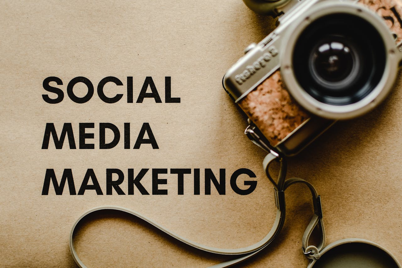 home-services-004 A vintage camera on brown paper with SOCIAL MEDIA MARKETING text, perfect for marketing visuals.